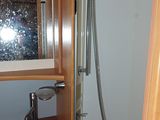 a sink and shower in a small bathroom