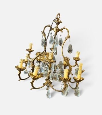an image of a chandelier made of brass and glass