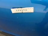 a sticker that says vauto on the side of a blue car