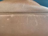 an image of a close up of a purse with a handle