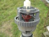 a picture of a sprinkler with a red cup on it