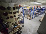 a room with a lot of shelves and a lot of tools