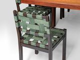 a wooden table with chairs around it and a wooden table with chairs around it