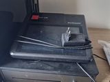 a laptop computer sitting on top of a black box