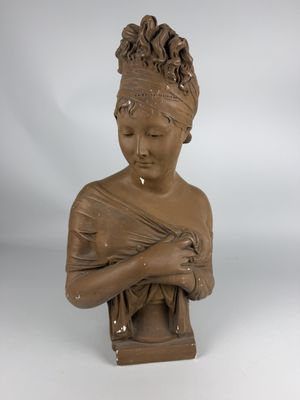 statue of a woman holding a baby in her arms