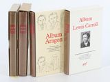 three books are stacked on top of each other on a white surface