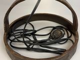 an old iron pot with a bunch of wires in it