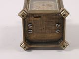 a small clock that is sitting on a table