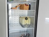 a refrigerator that has a lot of food inside of it