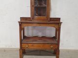 a small wooden table with a mirror on top of it