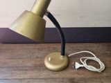 a lamp that is sitting on a table next to a charger