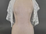 a mannequin torso with a white veil on top of it
