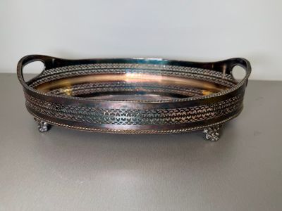 an image of a silver tray with handles on a table