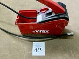 a red box with a black handle on the floor
