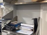 a kitchen with a microwave and a microwave oven in it