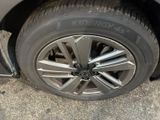 a close up of a tire on the side of a car