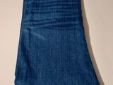 a close up of a pair of blue jeans on a table