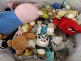 a basket full of stuffed animals and stuffed animals
