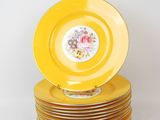 a lot of yellow plates stacked on top of each other