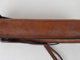 brown leather handbag on white background with strap