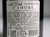 a label on a bottle of wine on a table