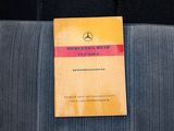 a mercedes service manual on the back of a car