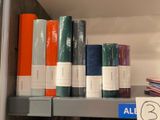 many books on a shelf in a book store