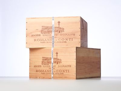 three wooden boxes stacked on top of each other on a table
