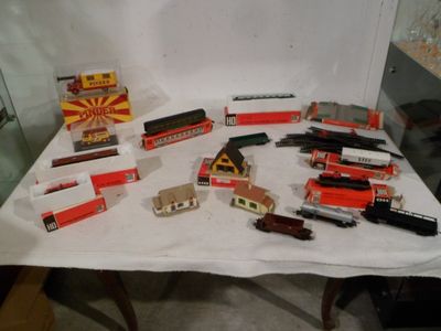 a table with a lot of toy trains on it