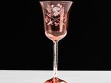 a wine glass that is sitting on a table