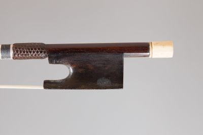 a bow that is attached to a string with a wooden handle