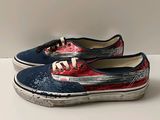 pair of red, white and blue vans style shoes on a white surface