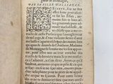 an open book with a black and white image of a man ' s face on it