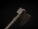 an old axe with a wooden handle on a black background