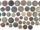an image of a pile of old coins sitting on top of a white surface