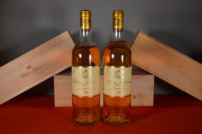 two bottles of wine sitting next to each other on a table