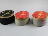 three tins that are sitting next to each other