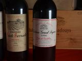 three bottles of wine sitting next to each other on a table