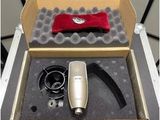 a box that has a microphone in it and some other items in it