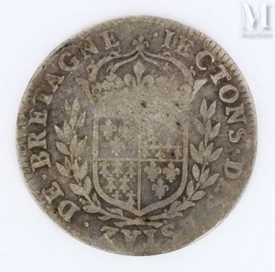 a close up of a coin with a coat of arms on it