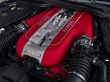 a red engine in the engine bay of a car