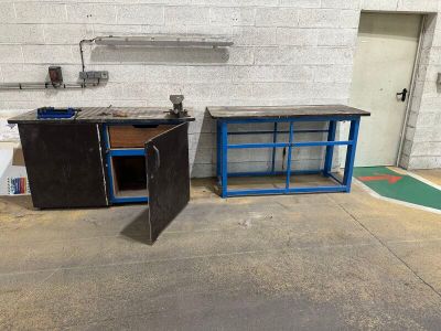 two tables and a cabinet in a room
