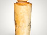 a vase that is sitting on a white surface