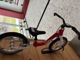 a bicycle that is sitting on the floor in front of a window