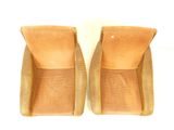pair of tan leather handbags on white background