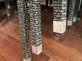 a close up view of a table with a bunch of chairs