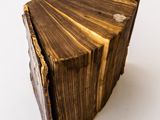 an old book that is sitting on a table