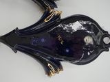 an image of a blue fish shaped object on a white surface