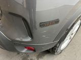 a close up of a car ' s rear end with a sticker on it