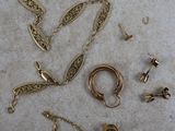 a lot of jewelry that is laying out on the floor